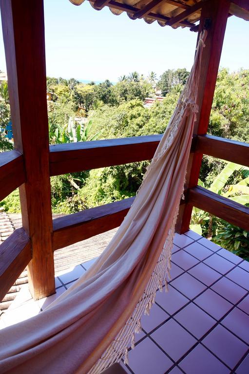 Novos Baianos Hostel E Pousada Porto Seguro Extérieur photo A hammock hanging from a balcony