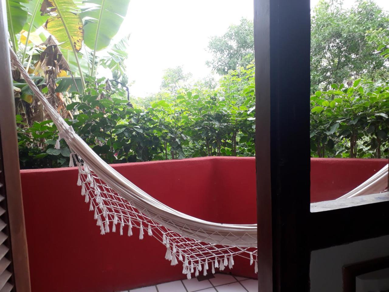 Novos Baianos Hostel E Pousada Porto Seguro Extérieur photo A hammock on a balcony